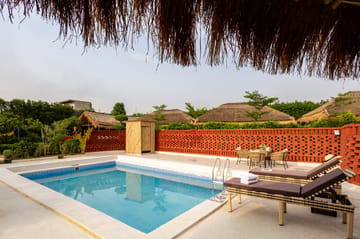Kimaya Kove | Hut-Style Cottage with Open-Air Shower, Shared Pool, Restaurant, and Garden in Boutique Resort - Image 3