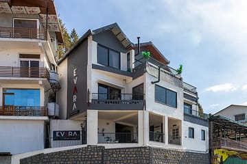 Evara | Serene Pet-friendly 4-BHK Hill Retreat With Balcony, Fireplace & Scenic Views - Image 2