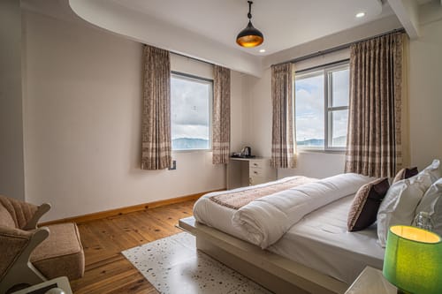 Trio’s Top | Hilltop Pet-friendly 2-BHK with Shared Sit-out Area, Stepped Garden & Hill Views