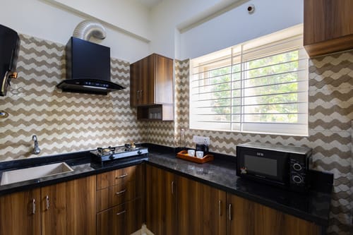 SLV Ventures Abhignya | 2-BHK Urban Stay With Private Balcony & Green View With Lift – 2 bedroom villa in Bengaluru, Karnataka