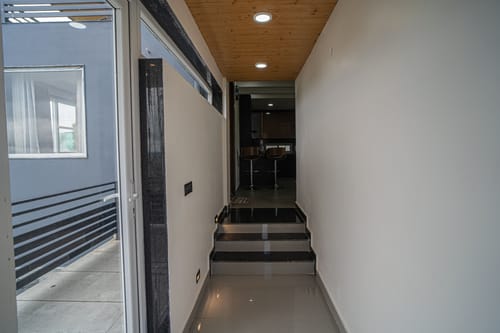 Trio’s Top | Hilltop Pet-friendly 2-BHK with Shared Sit-out Area, Stepped Garden & Hill Views