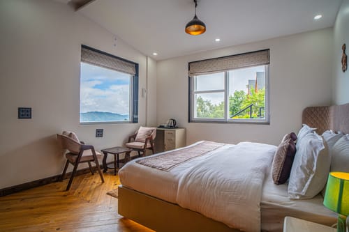 Trio’s Top | Pet-friendly 2-BHK with Attic, Shared Sit-out Area, Stepped Garden & Hill Views