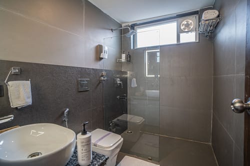 Trio’s Top | Pet-friendly 2-BHK with Attic, Shared Sit-out Area, Stepped Garden & Hill Views