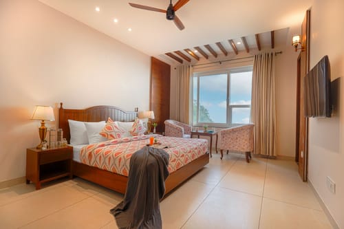 Konifer Wild Fern | Hilltop 2-BHK Retreat with Scenic Views, Shared Garden & Outdoor Seating Space