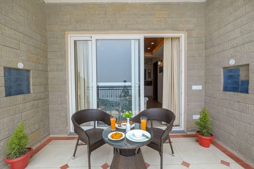 Konifer Wild Fern | Hilltop 2-BHK Retreat with Scenic Views, Shared Garden & Outdoor Seating Space
