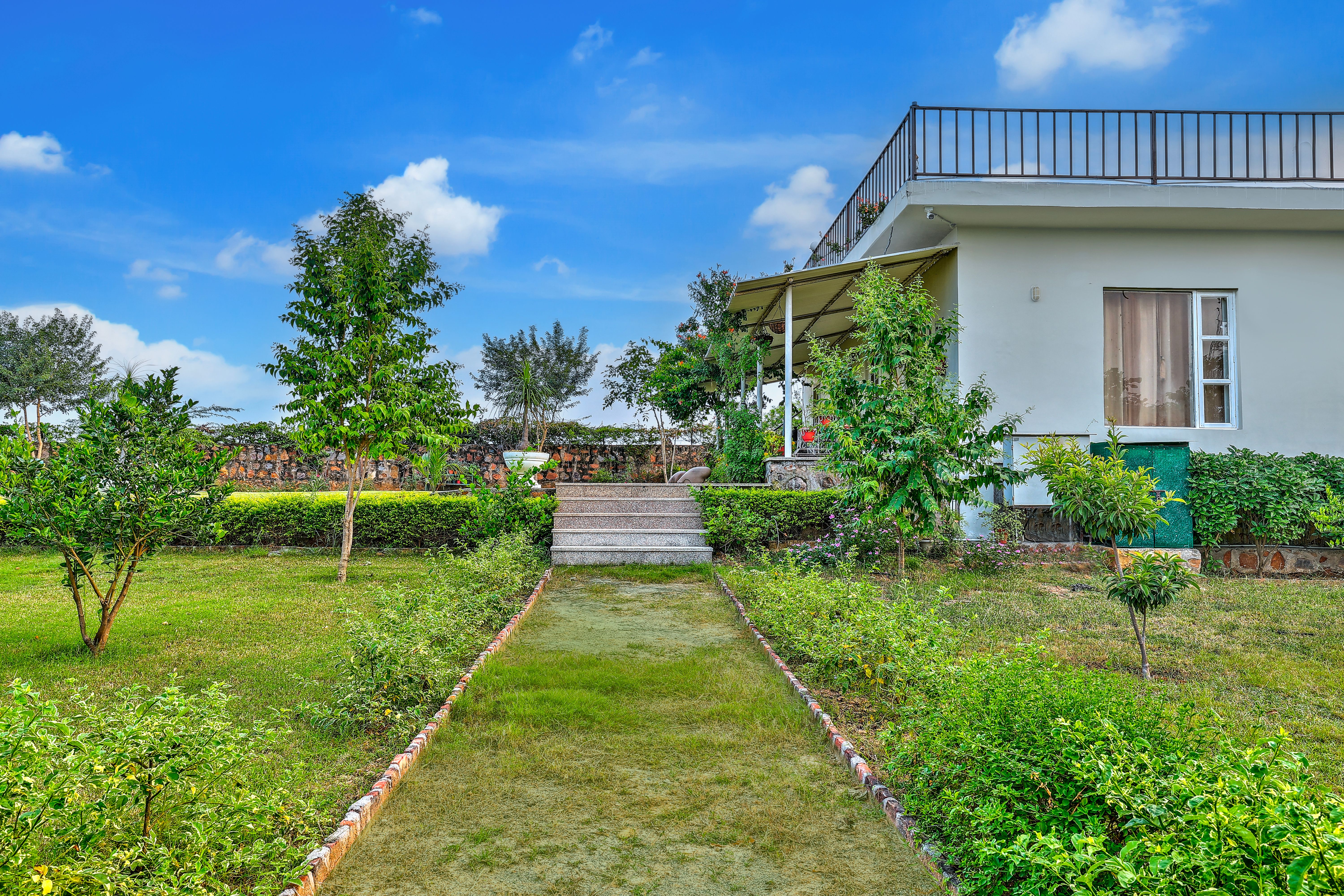 Aravale Farm | Pet-friendly 4-BHK Farmhouse With Private Pool, 2-Acre Lush Garden & Aravali Views - Image 4